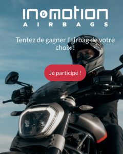 Airbag moto In&motion porté par un motard, illustrant la technologie de protection invisible et connectée